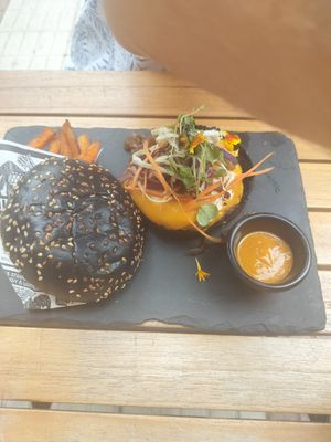 "The game changer" burger Beyond meat with sweet potatoes fries and spicy saus at Hustle n' Flow Eatery in San Pedro De Alcantara