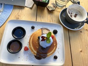 OG gluten free, vegan pancakes with spirulina, salted caramel whipped cream (interesting texture and flavor!)and house made “Nutella” like chocolate sauce with maple syrup. Yum at Hustle n' Flow Eatery in San Pedro De Alcantara