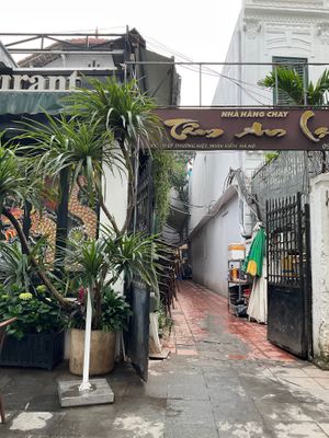 Entry to the Restaurant - alley next door to a black cafe/restaurant..   at Tam An Lac - Hoan Kiem in Hanoi