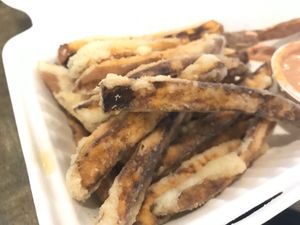 Hand cut sweet potatoes fries at Flourish Plant-Based Kitchen - Food Truck in Portland