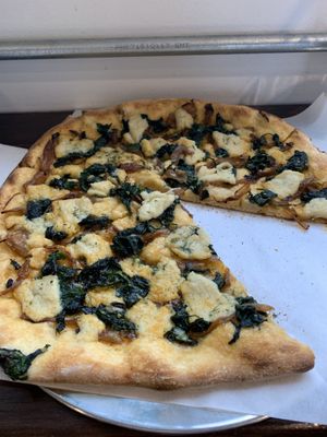 Spanakopizza veganized with cashew cheese made in house.  at Hildegard's Bakery in Winnipeg