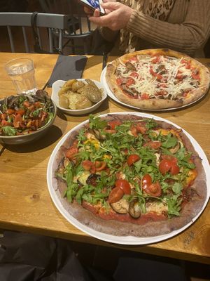 Turmeric base - top pizza , gluten free purple corn - bottom pizza. Delicious  at Dough Pizza in Bath