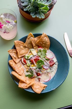 Grilled corn ceviche

corn / cherry tomatoes / tortilla chips / avocado / cashew crema with coriander / radish / ash at Eden Bistro in Warsaw