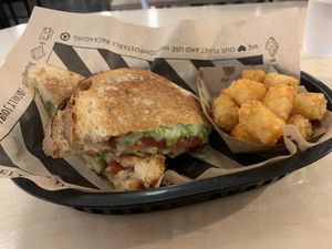 DIY Vegan Grill Cheese with guacamole, vegan cheese, garlic pickles, and awesome tots.  at The Grilled Cheeserie in Nashville