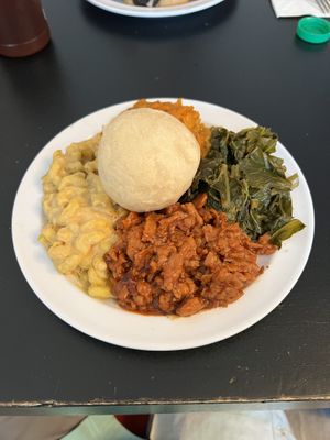 Soul food. BBQ chicken, collard greens, sweet potatoes, Mac and cheese and a roll.  at Vegelicious in Nashville