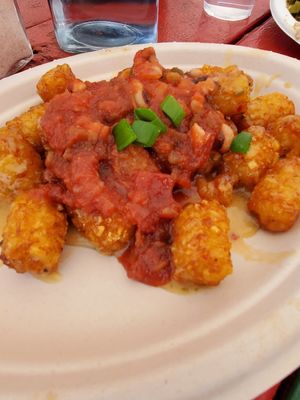 Tots have a salsa and cheese sauce! at Vegelicious in Nashville