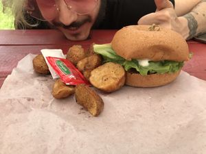 BBQ Tofu Burger served with home fries. at Vegelicious in Nashville