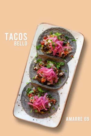 tacos de portobello guisado, pico de gallo, cebolla curtida y guacamole. at Amarre 69 in Barcelona