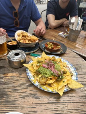Nachos, patatas bravas and olives   at Amarre 69 in Barcelona