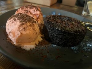 Chocolate molten cake with strawberry ice cream   at Amarre 69 in Barcelona