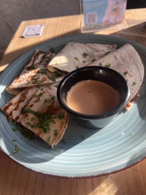 Minced Meat Quesodillas with cheese sauce on sidee  at Amarre 69 in Barcelona