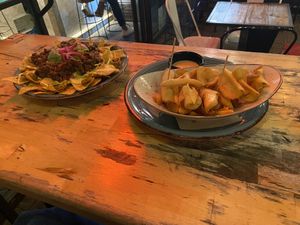 Nachos con carne and patatas bravas 69  at Amarre 69 in Barcelona