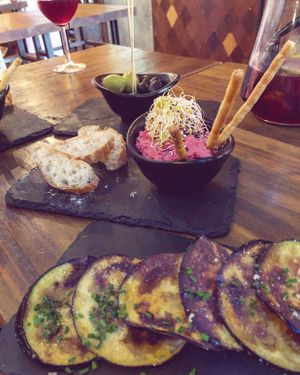 Olives, hummus, eggplant.   at Amarre 69 in Barcelona