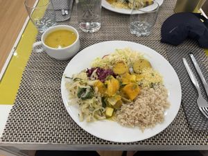 Veg & millet soup; rice, cabbage, seitan stew and more on the plate  at Vida Leve in Faro