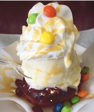 Donuts with icecream, caramel souce, toppings and chantilly at NiceCream in Santiago