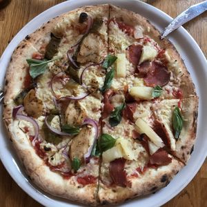 Plant-based chicken on left, Hawaiian with plant-based smoked ham on right    at Manso Pizzeria in Barcelona