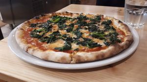 Spinach pizza at Manso Pizzeria in Barcelona