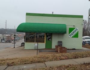 There are picnic tables behind the building for eating in nice weather. at Fozzie's Sandwich Emporium in Richmond Heights