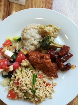 Bulgur and Greek salad, BBQ seitan, Indian tofu ragout and broccoli at 827 Speciality Kitchen - Kalvin in Budapest
