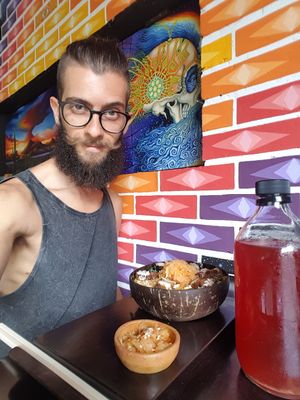 Eating my bowl and drinking some blueberry kombucha at Wachuma in Antigua