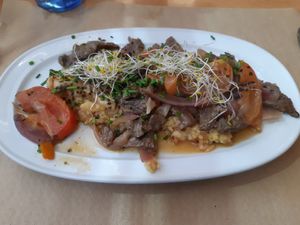 Main: Tacu tacu con lomito al jugo at Los Andenes Vegan in Madrid