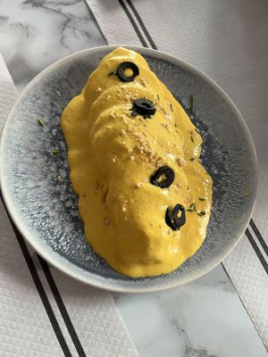 Papas a la huancaína  at Los Andenes Vegan in Madrid