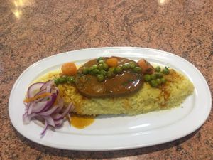 Tacu tacu de pallares con filete de seitan at Los Andenes Vegan in Madrid