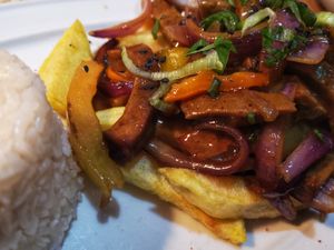 Seitan with chips and Peruvian typical sauce  at Los Andenes Vegan in Madrid