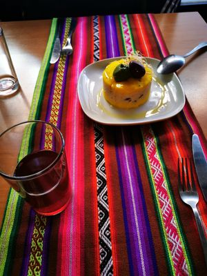 Causa limeña y chicha morada at Los Andenes Vegan in Madrid