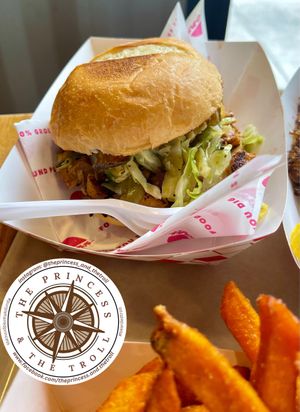 FOOLED PORK 
jackfruit, spicy prickly pear bbq sauce, coleslaw, fried pickle chips, potato bun  at Beaut Burger in Tucson