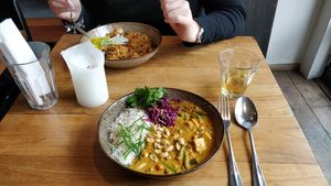 Peanut curry bowl (front) Kimchi bowl (back) at SOIL Vegan Cafe - West in Amsterdam