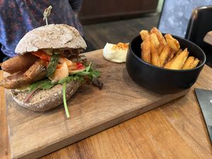 Choripán Burger w/ Fries  at SOIL Vegan Cafe - West in Amsterdam