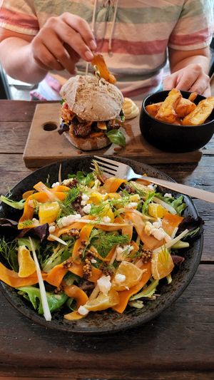 Reuben burger and salmon salad at SOIL Vegan Cafe - West in Amsterdam