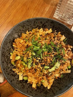 Kimchi fried rice with edamame, black fungi, mungo sprouts, season’s veg, crispy onions, daikon, scallions  at SOIL Vegan Cafe - West in Amsterdam