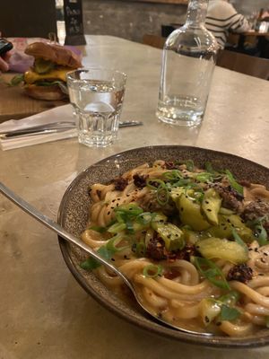 Cheddar Burger in the background  at SOIL Vegan Cafe - West in Amsterdam