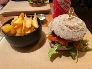 Reuben Burger with Tempeh, Kimchi and fries at SOIL Vegan Cafe - West in Amsterdam