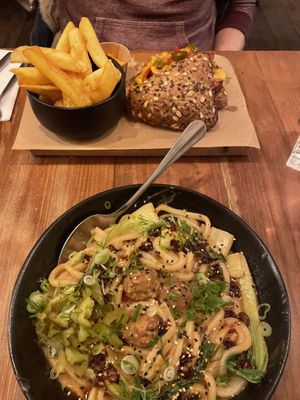 Ben Ben noodles and spicy seitan sandwich with fries  at SOIL Vegan Cafe - West in Amsterdam