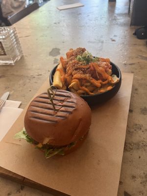 Chezy burger and kimchi fries  at SOIL Vegan Cafe - West in Amsterdam