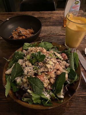 Middle Eastern salad with vegan chicken. Yum! Turmeric latte and side of kimchi 👍🏻👍🏻 at SOIL Vegan Cafe - West in Amsterdam