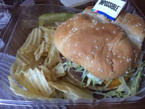 $9.50 for this impossible burger (I put vegan cheese vegan mayo tomato lettuce & onion on it) it was amazinggggg! Comes with chips & pickle  at Aleko's 2 Go in Hagerstown