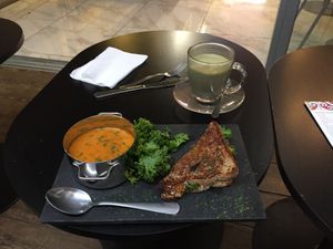 I already ate half my grilled cheese before I took this. It was so good, and the tomato basil soup and matcha latte were too! at Gia Vegan Pastries in San Pedro