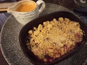 Crumble with vegan custard at The Harrow Inn in Warlingham