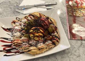 Waffle with mango and berry ice cream. Chocolate sprinkles and kiwi on top. at Leckerschmecker in Cologne