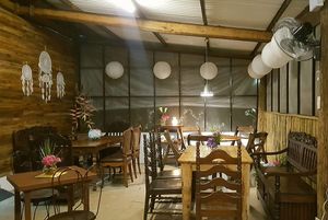 Eclectic mix of tables and seating at Sentro Botanikos Eco-Farm in Cavite