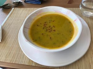 Sopa de abóbora e coentros. at Surya Cafe in Portimao