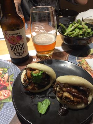 Vegan Steamed buns, Katsu ipa with passion fruit, Edamme beans chilli & garlic at Wagamama - Printworks in Manchester