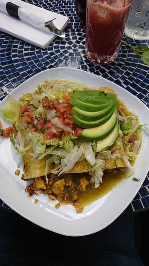 Vegan enchiladas with the soyrizo at Lazy Hippo at The Whiskey House in San Diego