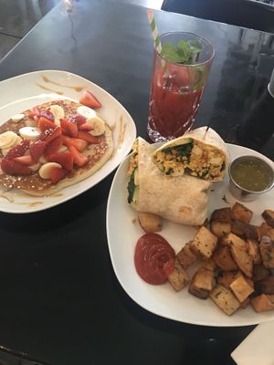 Vegan burrito with a side of golden pancakes (v) + beetroot/carrot/OJ juice  at Lazy Hippo at The Whiskey House in San Diego