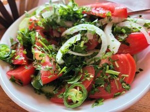 Tomato and cucumber salad with oil. Bland and tasteless, even with added oil and salt. No idea how something this good looking could be flavourless, but it wasn't worth it at all c at Machakhela in Tbilisi