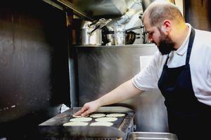 in the kitchen of grizzly tacos making handmade tortillas at Grizzly Tacos in Bratislava